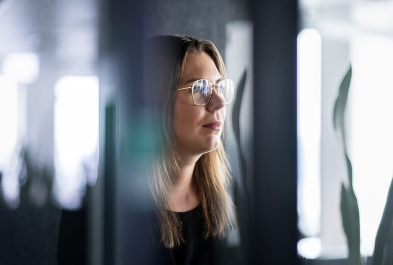 A trustworthy looking woman hard at work in an office